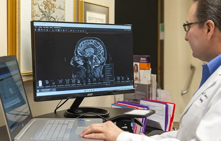 Dr. Kenneth Martinez reviews a patient X-ray on screen