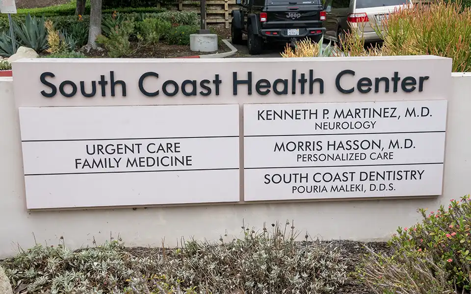 Building marquee for South Coast Health Center with Kenneth P Martinez listed.