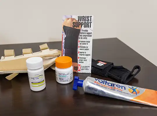 An assortment of wrist braces and pain medications for neuromuscular issues.